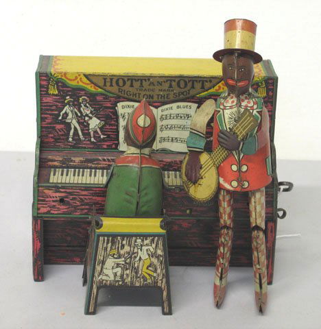Hott an Tott Right on the Spot" tin litho wind up: Hott an Tott Right on the Spot" tin litho wind up toy by Unique Art Marked with sticker bearing: Unique Art MFG., Co. Newark NJ USA copyrighted by unique art mfg. co. date scratched out. In working or