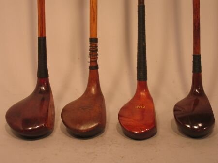Four various hickory shafted woods: Four various hickory shafted woods, comprising a Tom McNamara brassie; a Clan scared head wood; a Guss Bell Rock Nocker driver; and an un-named brassie (4)
