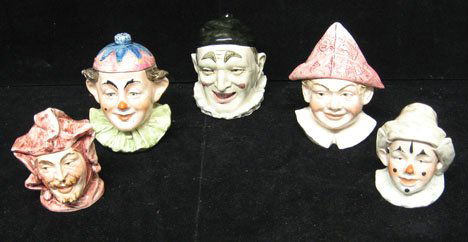 Group of five jester and clown head Continental: Group of five jester and clown head Continental tobacco jars early 20th century All with incised nos. to underside, one stamped 'Made in Czechoslovakian'. Tallest H: 6 in.