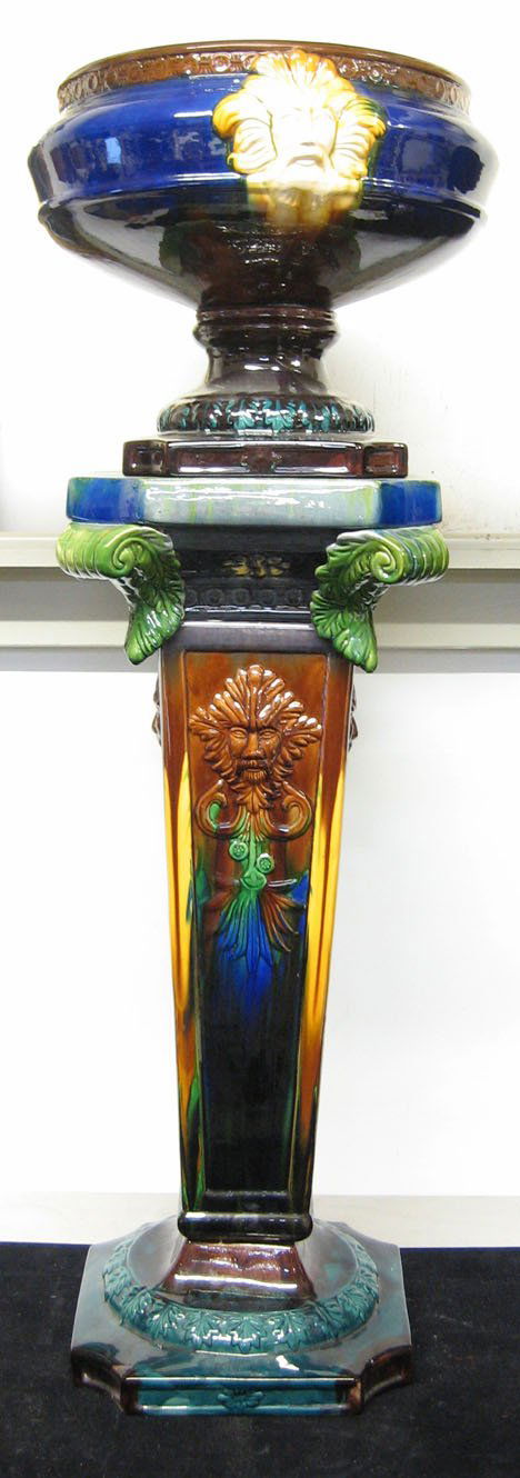 Majolica jardiniere on stand, 20th c., A round ja: Majolica jardiniere on stand 20th c. A round jardiniere on columnar support with molded decoration and various color glaze H: 44 in. PROVENANCE: From the collection of Marie Evans, Alexandria, Virgini