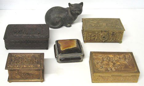 Bronze cat together with five decorative boxes, ,: Bronze cat together with five decorative boxes Bronze cat L: 7 in., 4 relief decorated metal boxes each with figural scenes L of largest: 6 3/4 in. and one box applied stone decoration.