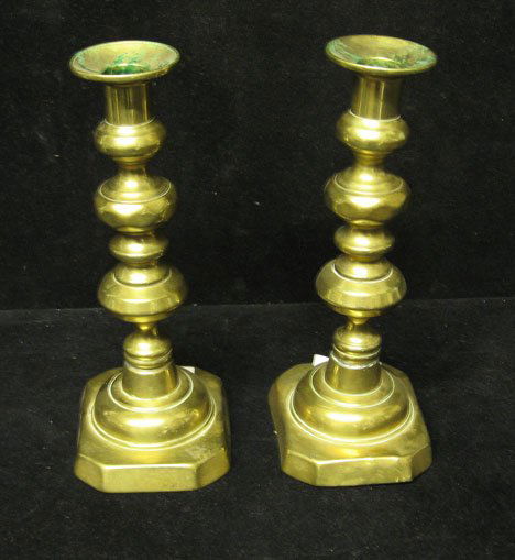 Pair of brass push up candlesticks, 19th c., RIng: Pair of brass push up candlesticks 19th c. RIng turned shaft with square base. H: 9 5/8 in. PROVENANCE: From the collection of Marie Evans, Alexandria, Virginia