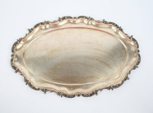 An Austro-Hungarian Rococo Style Silver Serving Tr: An Austro-Hungarian Rococo Style Silver Serving Tray, with maker's initials' CF, 800 mark, having a C-scroll border surrounding the ovoid tray. Length 19 1/2 inches.