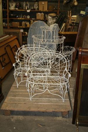 A Three Piece Painted Wire Garden Set, Length of s: A Three Piece Painted Wire Garden Set, comprising two diminutive settees and a demilune plant stand. Length of settees 26 1/4 inches. Property from an Important Lake Forest, Illinois Estate.