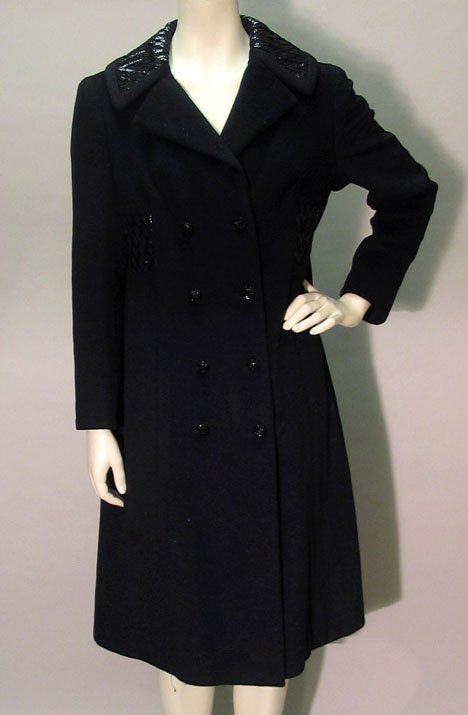 Black wool Lilli Ann winter coat, early 1960s, Do: Black wool Lilli Ann winter coat early 1960s Double-breasted felted wool with black molded glass buttons, notch collar with sequined trellis" design inset at the waist sides and on the upper collar."