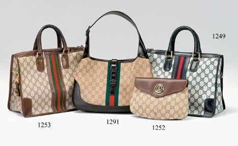 Gucci clutch purse, 1970s-80s, Rounded envelope s: Gucci clutch purse 1970s-80s Rounded envelope style clutch in woven signature canvas; leather flap a large enamel stylized double-G" detail at front."