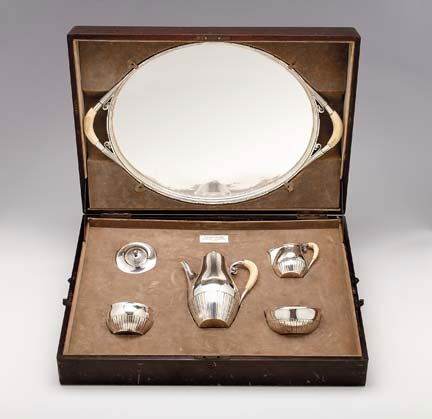 Cased Georg Jensen five piece sterling silver co: Cased Georg Jensen five piece sterling silver coffee service, designed by Johan Rohde circa 1925-30 Comprising a coffeepot, a tea tray, a covered sugar bowl, a slop bowl and a creamer, each of part fl