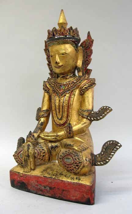 Thai gilt and glass inlay figure of Tara, 20th c: Thai gilt and glass inlay figure of Tara 20th century The seated gilded figure, adorned with colored glass inlay to crown, vestment, and sprays coming from the knees, seated on a red painted triangula