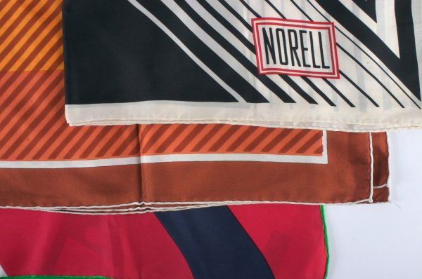 A Group of Three Designer Scarves,: A Group of Three Designer Scarves, including Guy Laroche, Norell, and Lapidus.