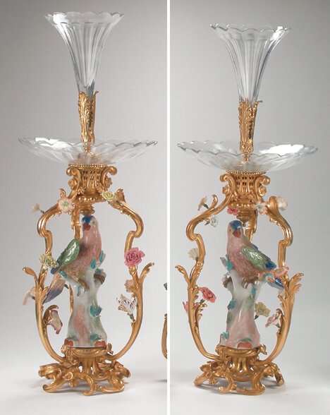 PAIR OF LOUIS XV-STYLE, PORCELAIN-MOUNTED, GILT-B: PAIR OF LOUIS XV-STYLE, PORCELAIN-MOUNTED, GILT-BRONZE EPERGNES The flared vase surmounts and lobed bowls raised on three flower-encrusted flower supports centered by brightly colored birds raised on