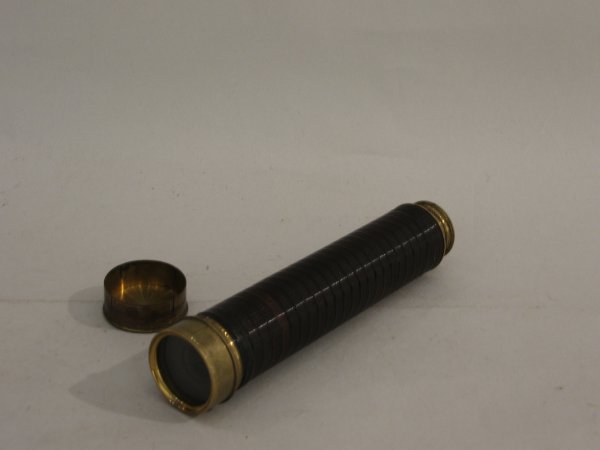 Brass spyglass, 19th century, Cox, Devenport, insc: Brass spyglass 19th century Cox, Devenport, inscribed to draw tube, removable dust cap, tortoise shell hand rest, seven pull draw tube, 1 1/2 in subject lens, and slide cover eye piece. L: 22 in.
