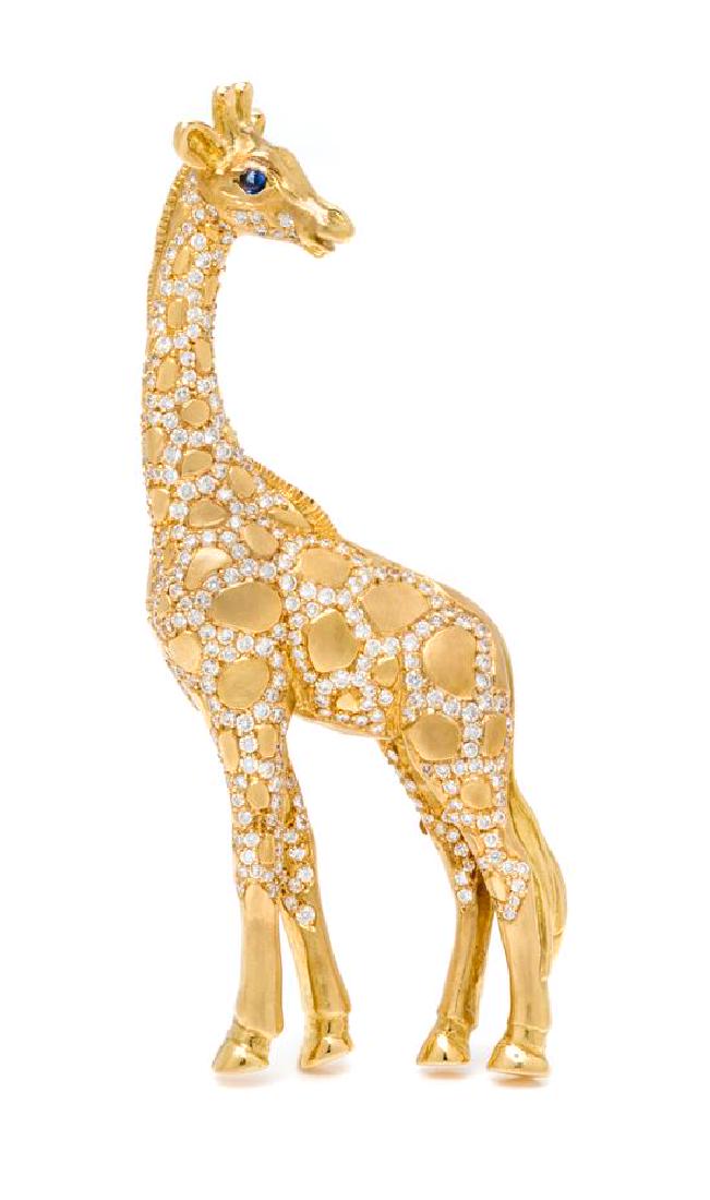 An 18 Karat Yellow Gold, Diamond and Sapphire Giraffe: An 18 Karat Yellow Gold, Diamond and Sapphire Giraffe Brooch, Julius Cohen, containing numerous round brilliant cut diamonds weighing approximately 2.00 carats total and two round cabochon cut sapphir