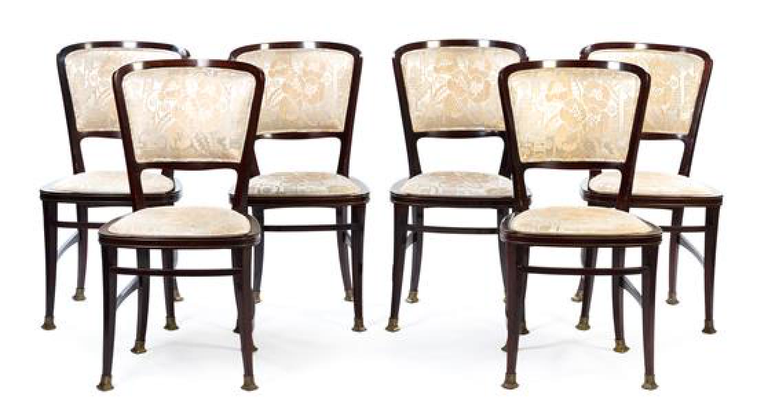 A Set of Six Brass Mounted Mahogany Dining Chairs: A Set of Six Brass Mounted Mahogany Dining Chairs portois & fix, 20th century each having a padded back and a drop-in cushion seat, with a metal tag stamped 1835 to the underside. Height 35 1/2 inches