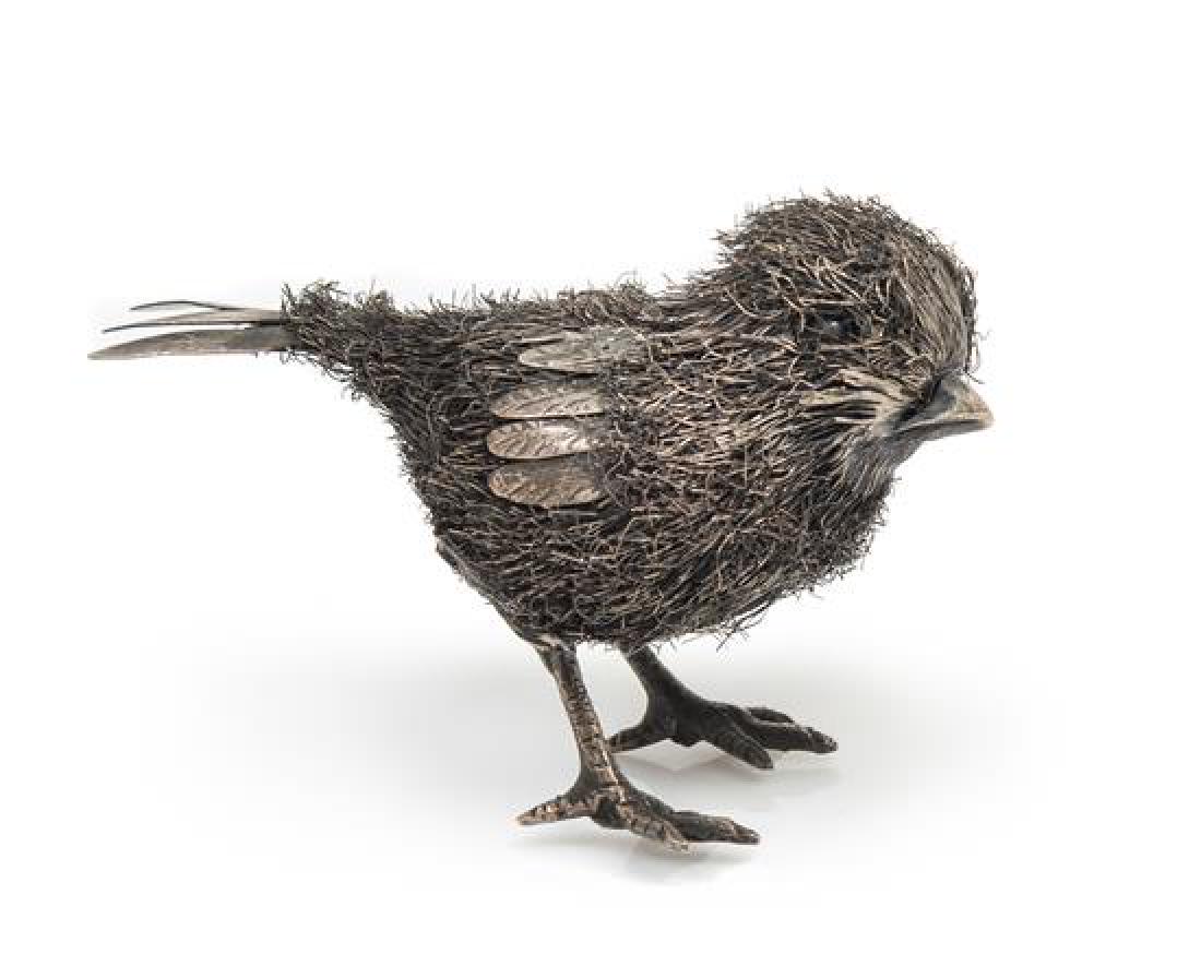 An Italian Silver Chick: * An Italian Silver Chick Buccellati, Florence, 20th Century the body formed of silver wire with a silver sheet wing and tail. marked '925' on underside of tail 17 dwts Length 3 inches. Estimate $ 600
