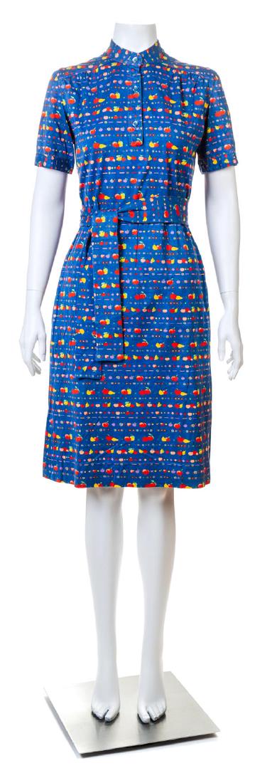 A Celine Blue Cotton Fruit Print Dress,: A Celine Blue Cotton Fruit Print Dress, with short sleeves, a mandarin collar with button closure, a gathered elastic waist, front slip pockets and a self tie belt. Labeled: Celine. Size 40; Self tie:
