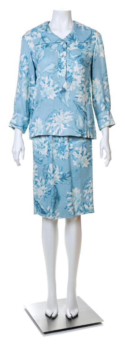 A Guy LaRoche Blue Floral Jacket and Skirt Set,: A Guy LaRoche Blue Floral Jacket and Skirt Set, comprised of a pullover jacket with a wide lapel, front vents and three button closure; together with a matching pencil skirt with a side zip closure. J