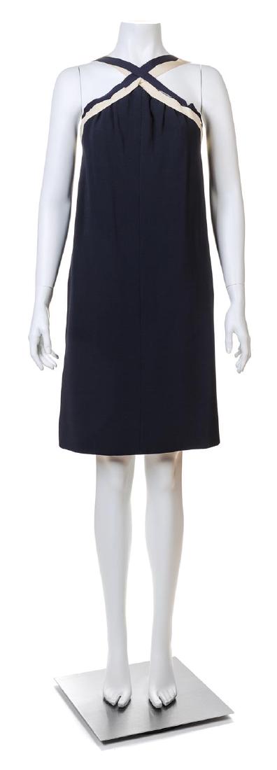 A Guy Laroche 1960s Navy Wool Haute Couture Sailor: A Guy Laroche 1960s Navy Wool Haute Couture Sailor Dress, with navy and white grosgrain ribbon criss-cross straps at the front and back, a pleated and corseted bodice and decorative ribbon bows at the