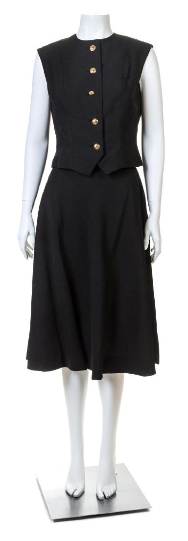 A Pauline Trigere Black Sleeveless Vest and Skirt Set,: A Pauline Trigere Black Sleeveless Vest and Skirt Set, comprised of a fitted vest with a round neck and decorative hammered goldtone front button closure; together with a matching A-line skirt with a 