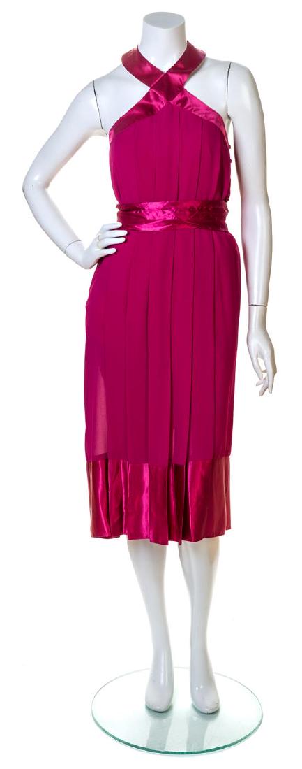 A Pierre Cardin Fuschia Pleated Cocktail Dress,: A Pierre Cardin Fuschia Pleated Cocktail Dress, with a halter neckline, silk trim at the bodice and hem, an open back, side covered button closure and a detachable self tie sash. Labeled: Pierre Cardi