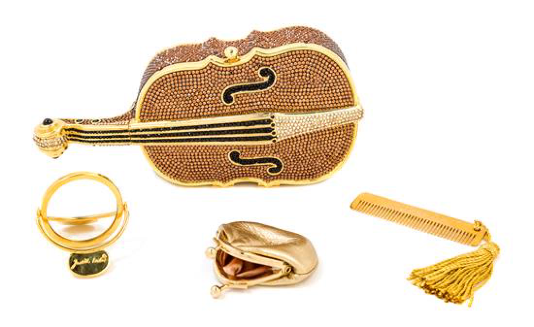 A Judith Leiber Crystal Cello Minaudiere,: * A Judith Leiber Crystal Cello Minaudiere, with a goldtone frame, a push clasp, an optional goldtone shoulder strap, a change purse and mirror. Together with a dustbag. Stamped: Judith Leiber. 3.5" x