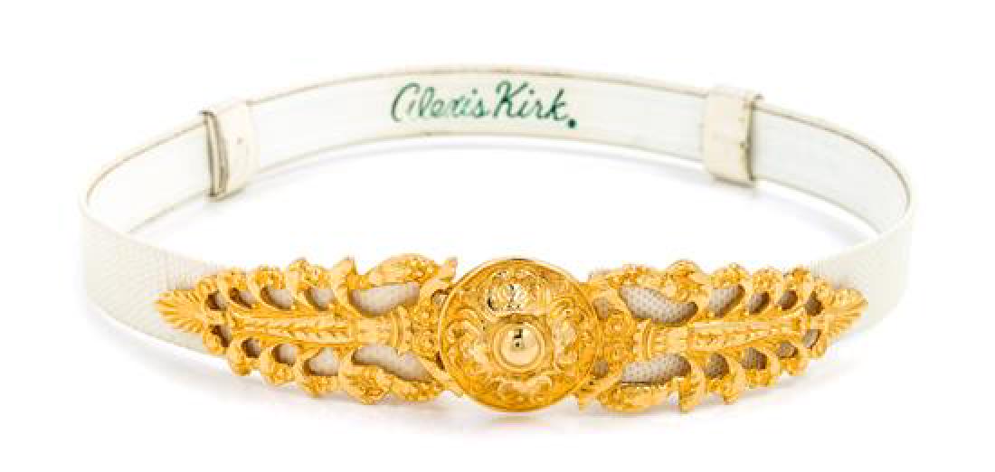 An Alexis Kirk White Belt,: An Alexis Kirk White Belt, with an adjustable slide design and a goldtone buckle with a hook closure. Together with a dust bag. Stamped: Alexis Kirk. Estimate $ 100-150 Overall very good condition.