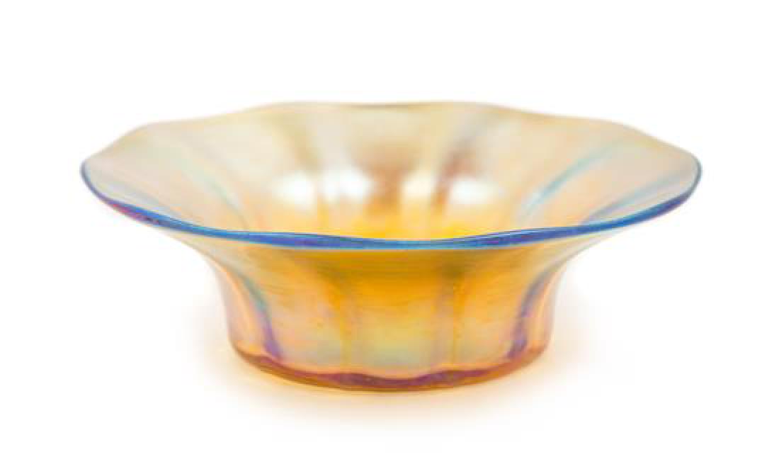 Tiffany Studios, EARLY 20TH CENTURY, a Favrile glass: Tiffany Studios EARLY 20TH CENTURY a Favrile glass bowl, with gold iridescence signed L.C.T. Favrile Diameter 6 inches Estimate $ 200-400