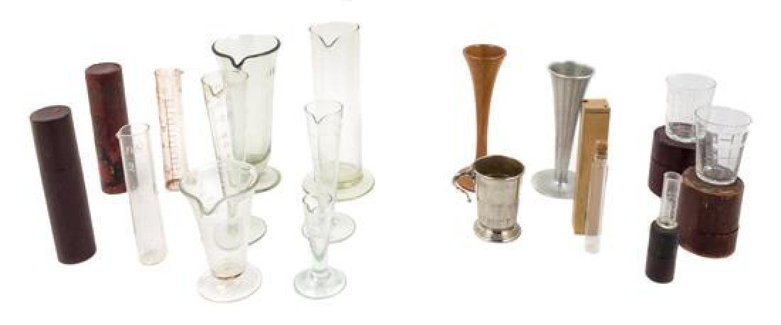 * A Collection of Measuring Beakers Height of tallest 7: * A Collection of Measuring Beakers 19th century and later comprising glass, metal and wood examples. Height of tallest 7 1/2 inches. Estimate $ 50-70 Property from the Collection of Dr. David Spatz, 