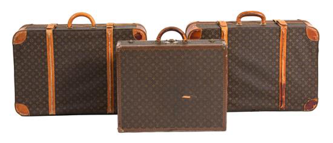 A Group of Three Louis Vuitton Suitcases Largest height (1 of 3)
