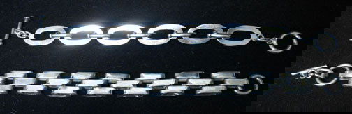 Two Sterling Mexican Link Bracelets, Styled in a: Two Sterling Mexican Link Bracelets Styled in a basket weave and an oval link design with toggle clasps. Both stamped 925 Mexico. L: 8 1/2 and 9 in.