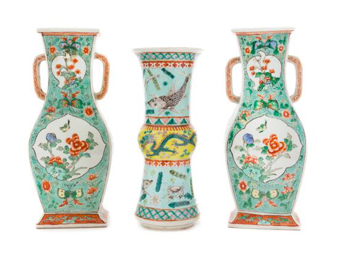 Three Chinese Famille Verte Porcelain Vases Height of: Three Chinese Famille Verte Porcelain Vases 19th century comprising a pair of square sectioned vases each painted with floral decoration, the recessed neck applied with a pair of arched handles, and a