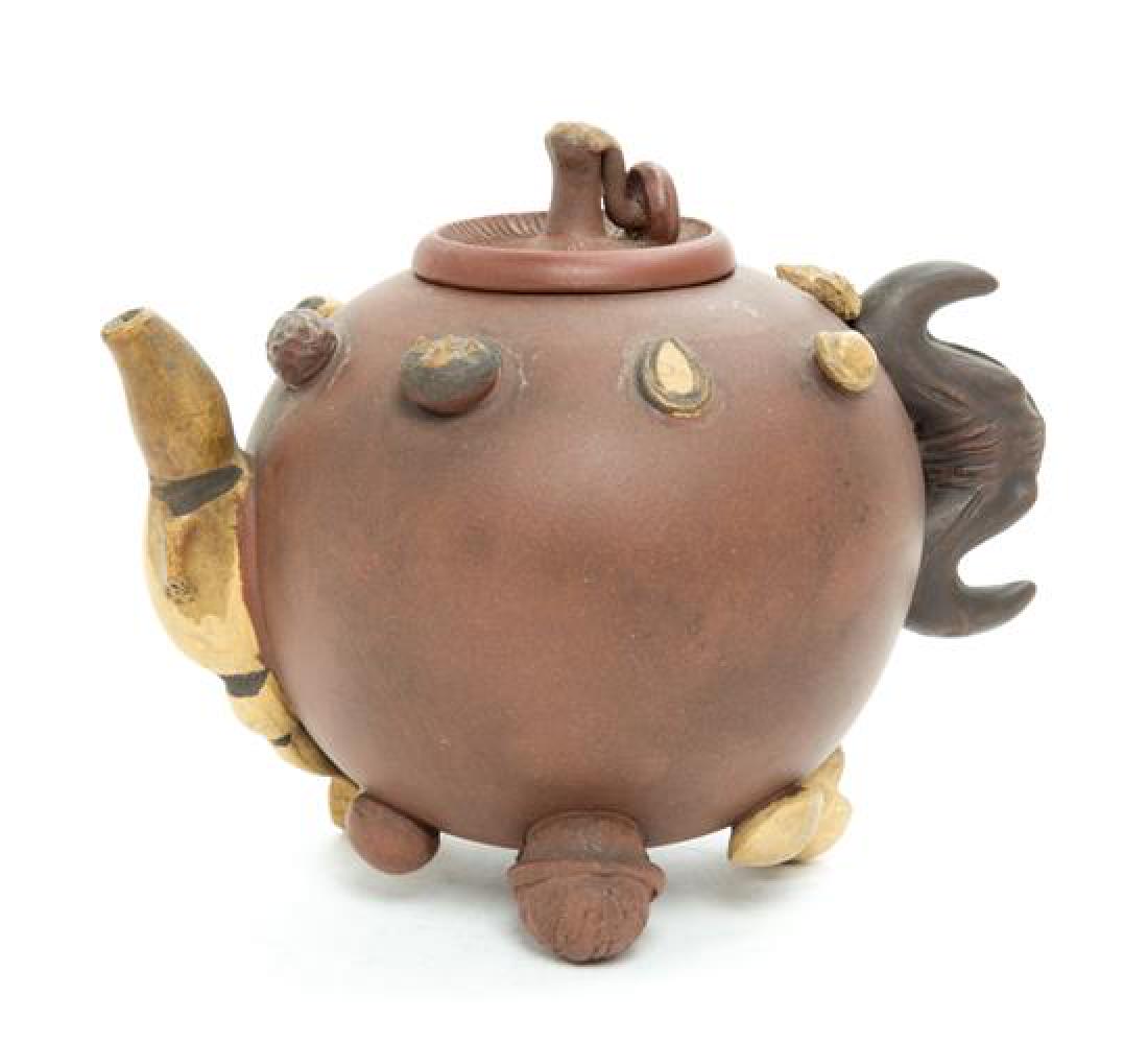 A Chinese Yixing Pottery Teapot Height 5 1/2 inches. (1 of 2)