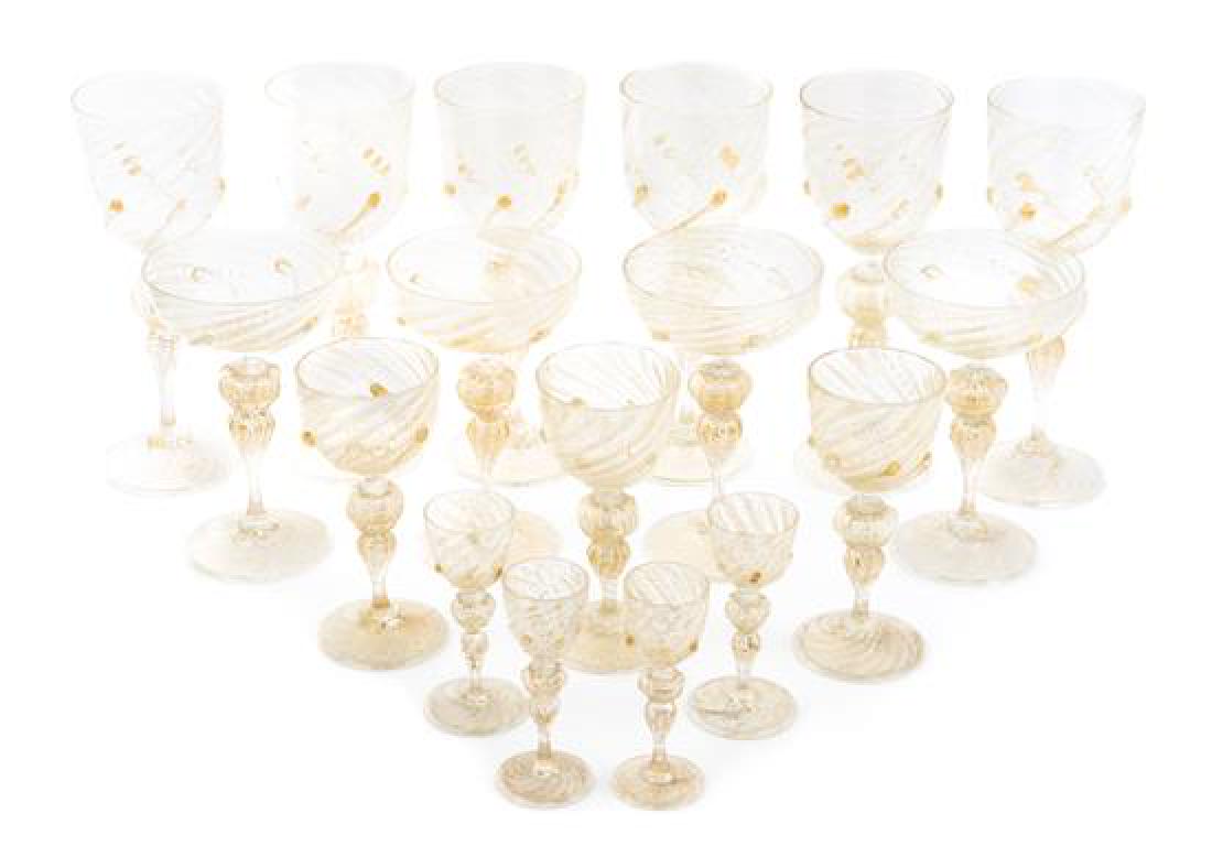 A Venetian Glass Stemware Service Height of tallest 9: A Venetian Glass Stemware Service 20th century comprising 9 wine stems of various sizes, 4 champagne coupes and 4 cordials, each with gilt foil decoration; 17 items total. Height of tallest 9 inches. 