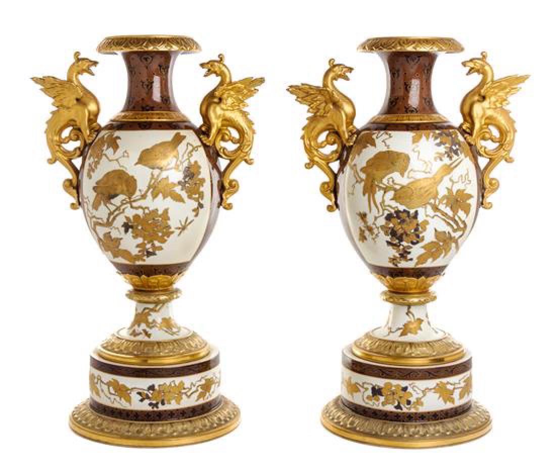 * A Pair of Pirkenhammer Porcelain Vases Height 23: * A Pair of Pirkenhammer Porcelain Vases late 19th century each of baluster form with dragon form handles, painted to show perched birds on branches, with transfer-printed crossed hammers mark to the
