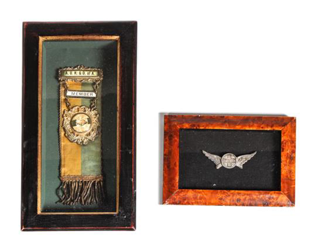 Two Framed Pins Larger (framed) 10 3/4 x 5 3/4 inches: Two Framed Pins one a lapel pin for the Santa Fe Railroad Larger (framed) 10 3/4 x 5 3/4 inches Estimate $60-80 Property from the Howard and Catherine Feldman Folk and Southwestern Art Collection