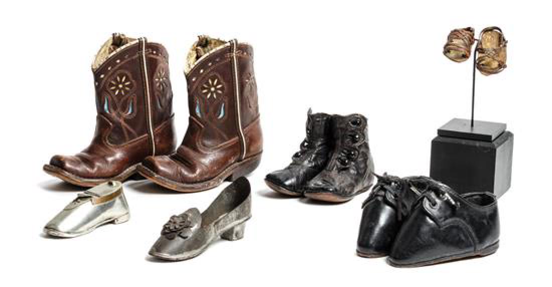 Group of Miniature and Child's Shoes Height of tallest: Group of Miniature and Child's Shoes comprising three pairs of child's shoes, two single metal examples and a pair of miniature sandals Height of tallest 6 1/4 inches Estimate $100-200 Property from t