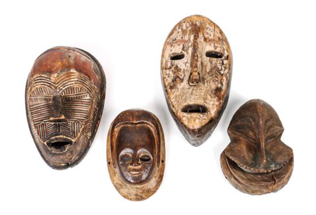 Four African Carved Wood Masks Height of largest 10 (1 of 1)