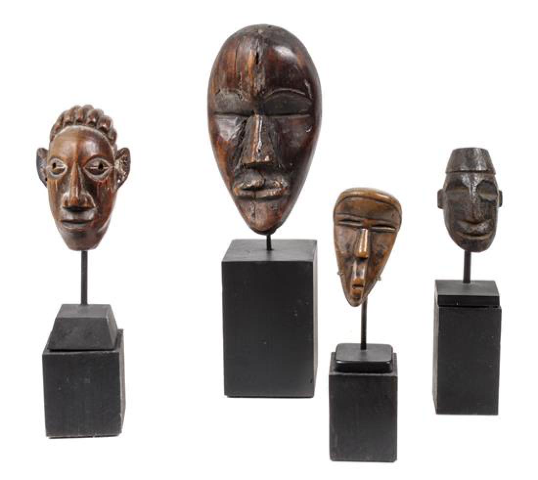 Eight Miniature Carved Wood African Masks Height of (1 of 2)