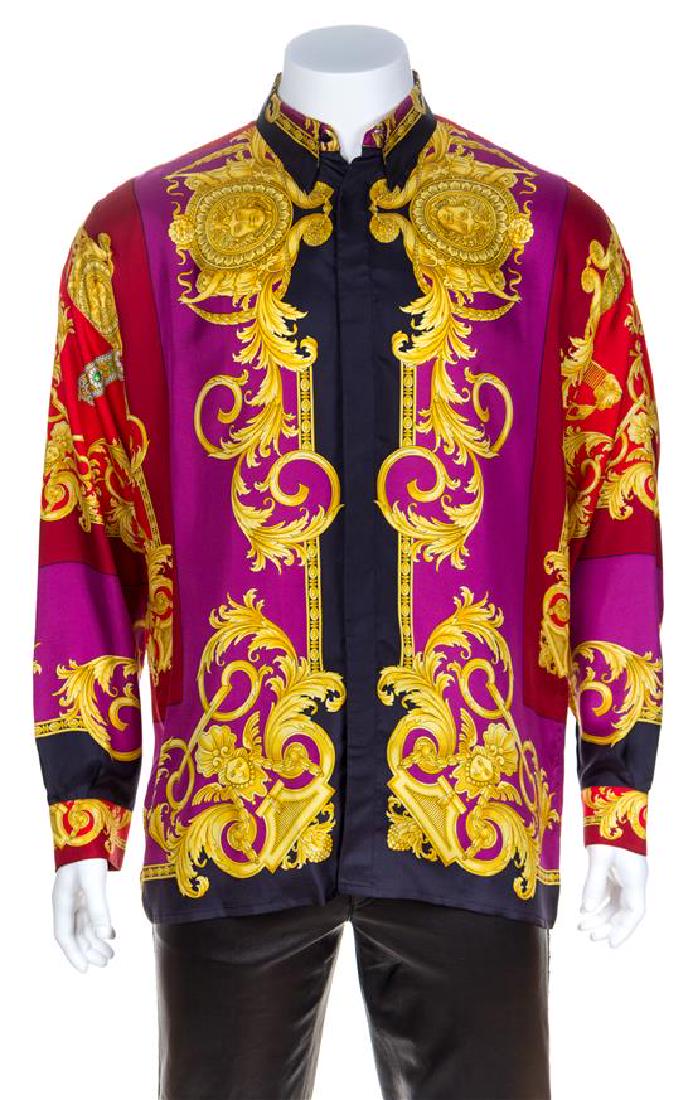 A Gianni Versace Silk Print Shirt, Size 54.: A Gianni Versace Silk Print Shirt, 1990s, "Baroque" print with decorative black faceted buttons at the top neck closure and cuffs and right side hidden button closure. Labeled: Gianni Versace. Size 54