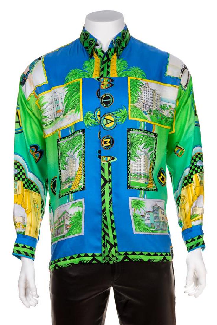 A Gianni Versace Silk Atelier Print Shirt, Size 48.: A Gianni Versace Silk Atelier Print Shirt, Spring/Summer 1993, "Miami" print with decorative black faceted buttons at the top neck closure and cuffs and right side hidden button closure. Design featur
