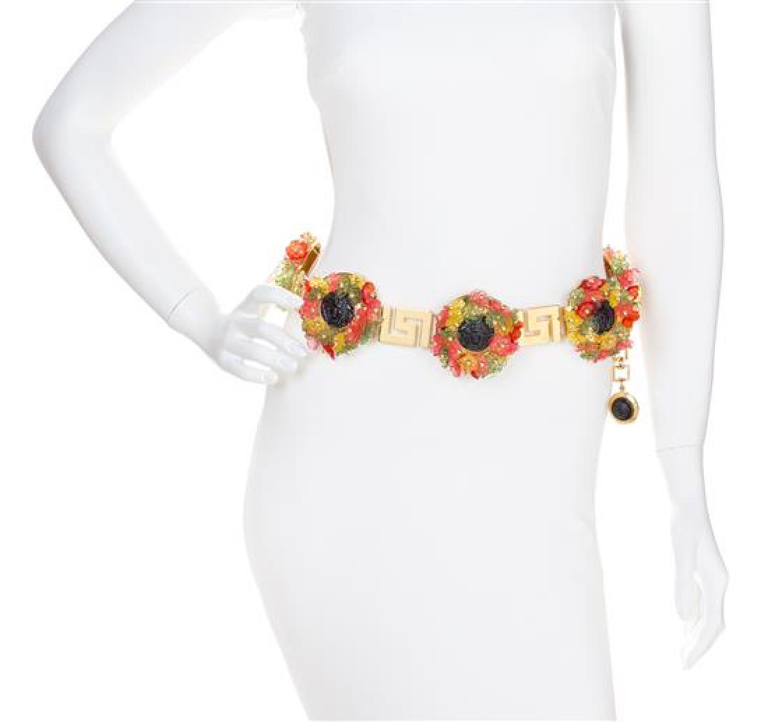 A Gianni Versace Multicolor Floral and Greco Link Belt,: A Gianni Versace Multicolor Floral and Greco Link Belt, Spring/Summer 1993, goldtone with resin flowers and black embossed Medusa medallion discs and an adjustable hook closure. Design featured in the