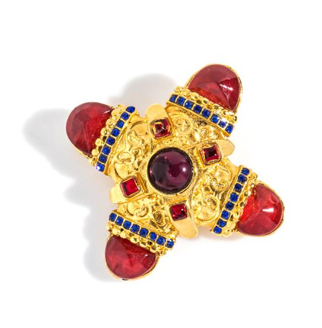 A Gianni Versace Maltese Cross Brooch, 2.75" diameter.: A Gianni Versace Maltese Cross Brooch, 1990s, goldtone with decorative red and purple stones and small blue rhinestones. Stamped: Gianni Versace. 2.75" diameter. Estimate $250-350 Property from a Sing
