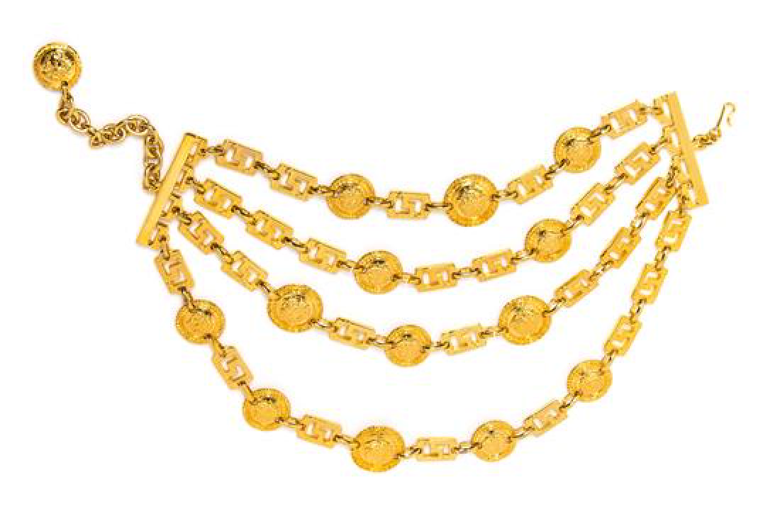 A Gianni Versace Four Strand Greco Link Choker, Length:: A Gianni Versace Four Strand Greco Link Choker, Spring/Summer 1993, goldtone with decorative Medusa embossed medallions and an adjustable hook closure. Unstamped and attributed to: Gianni Versace. Len