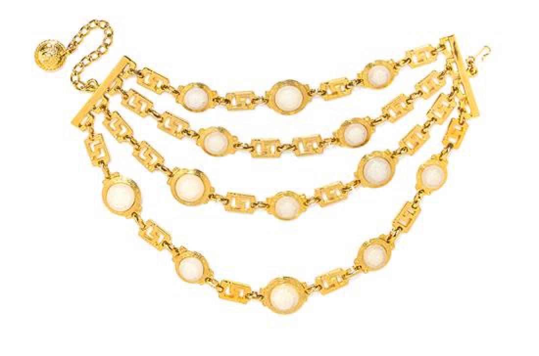 A Gianni Versace Four Strand Greco Link Choker, Length:: A Gianni Versace Four Strand Greco Link Choker, Spring/Summer 1993, goldtone with decorative white Medusa embossed medallions and a pin slide closure. Unstamped and attributed to: Gianni Versace. Leng