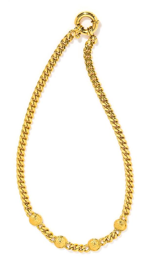 A Gianni Versace Gold Heavy Link Necklace, Length: 18".: A Gianni Versace Gold Heavy Link Necklace, 1990s, goldtone with four Medusa medallions with a wheel spring clasp. Together with pouch. Stamped: Gianni Versace. Length: 18". Estimate $400-600 Property