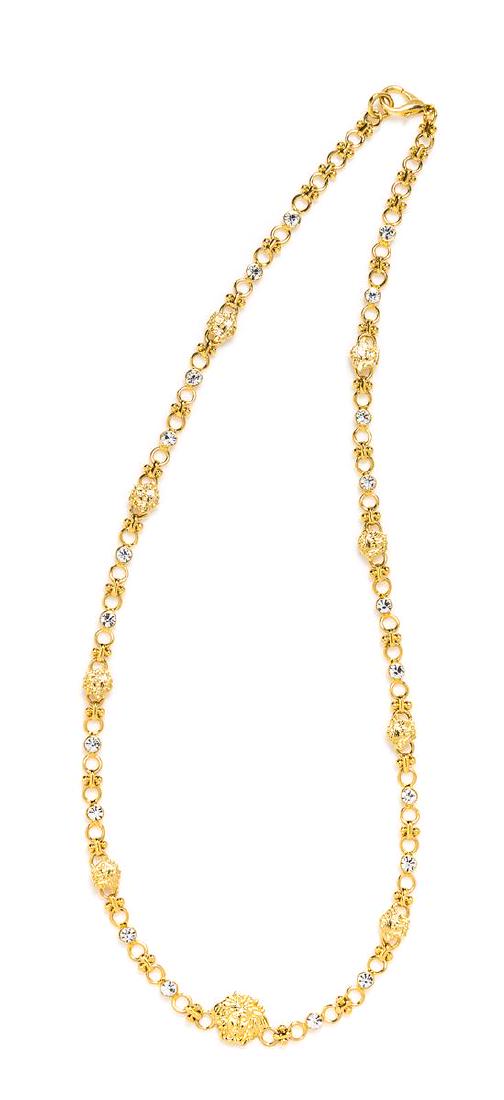 A Gianni Versace Medusa and Rhinestone Link Necklace,: A Gianni Versace Medusa and Rhinestone Link Necklace, 1990s, goldtone with a lobster clasp. Together with pouch. Stamped: Gianni Versace. Length: 26.75". Estimate $300-400 Property from a Single-Owner
