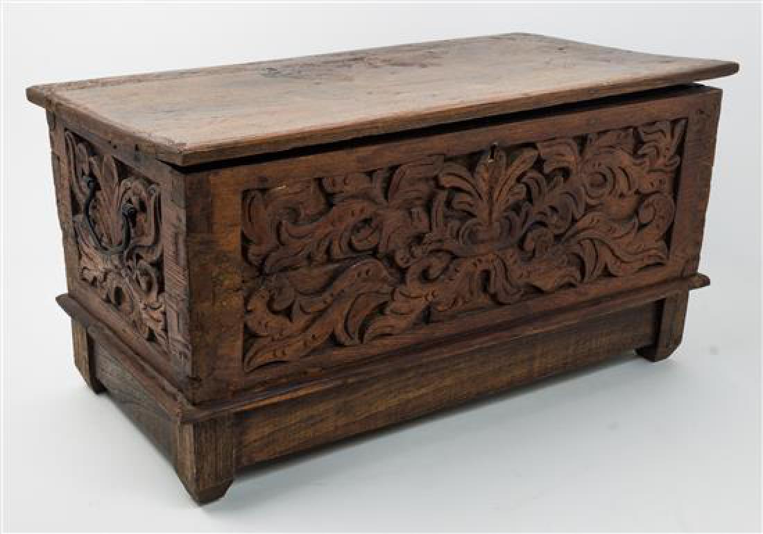 A Dutch Colonial Carved Campaign Chest: A Dutch Colonial Carved Campaign Chest 19th century the front and sides decorated with foliate motifs. Height 14 x width 25 1/2 x depth 13 inches. Estimate $400-600 Property from an Estate, Edina, Min