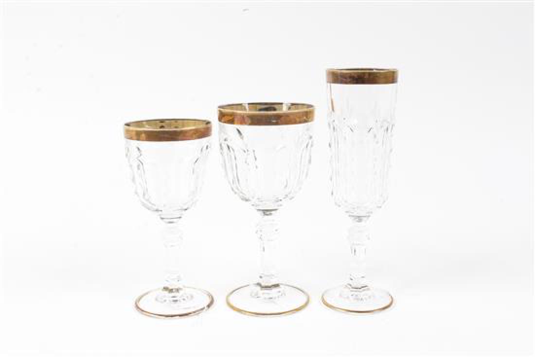 A Collection of Gilt and Etched Stemware: * A Collection of Gilt and Etched Stemware 20th century comprising: 8 champagne flutes 7 wine glasses 8 dessert wine glasses 1 cordial in total 24 items. Height of tallest 5 3/4 inches. Estimate $