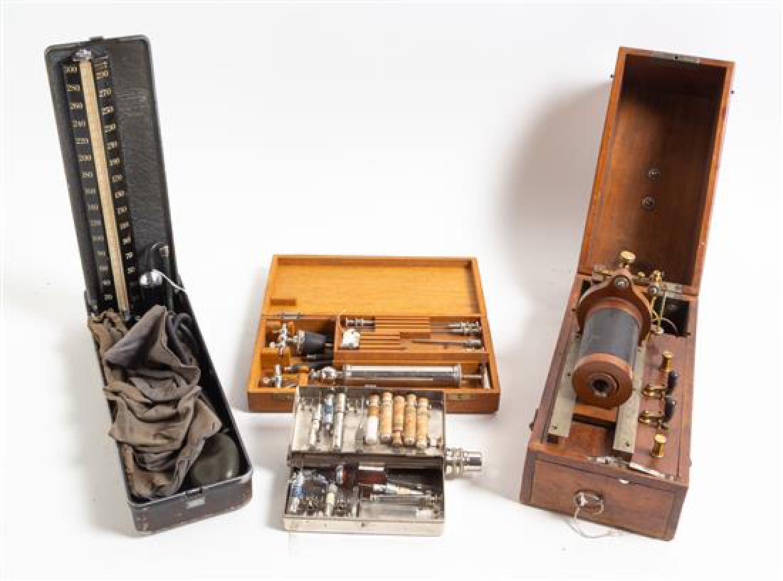 A Collection of Medical and Quack Medical Devices: A Collection of Medical and Quack Medical Devices 19th century and later comprising a Baumanometer sphygmomanometer in a fitted travel case, a German tooth veneer swatch, two electrical quack medicine