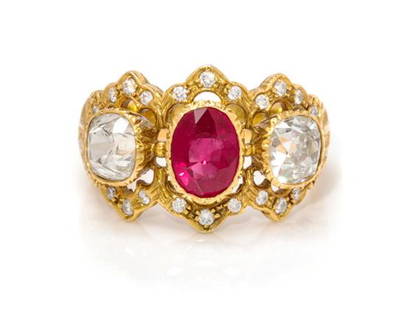 An 18 Karat Yellow Gold, Ruby and Diamond Ring, Mario: An 18 Karat Yellow Gold, Burmese Ruby and Diamond Ring, Mario Buccellati, containing one oval mixed cut ruby weighing approximately 1.50 carats, two old mine cut diamonds weighing approximately 1.95