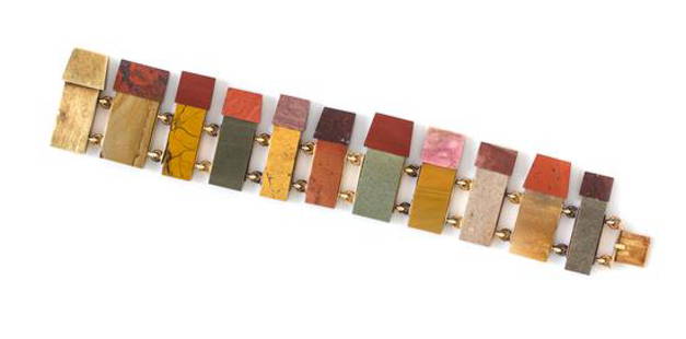 * An 18 Karat Yellow Gold and Multi Hardstone Bracelet,: * An 18 Karat Yellow Gold and Multi Hardstone Bracelet, Ole Bent Petersen, consisting of rectangular and trapezoid shaped plaques of jasper in various colors and shades including yellow, red, green an